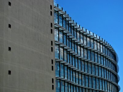 Grey Concrete Building With Blue Windows photo