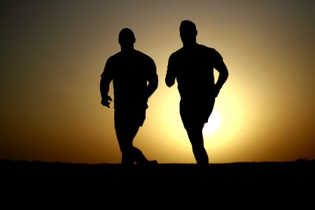 Silhouettes Of Runners