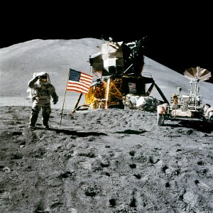 Astronaut Standing Beside American Flag On The Moon