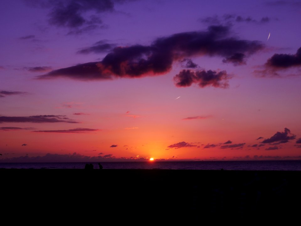 Sunset Over Ocean Horizon