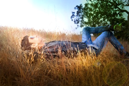 Man Laying In Field photo