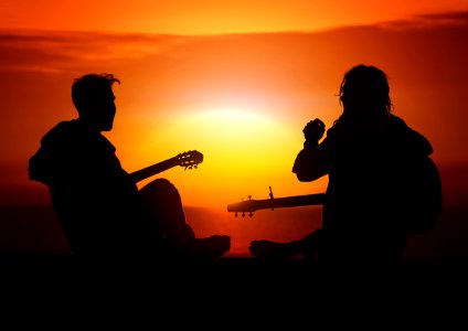 Silhouette Of Musicians At Sunset photo