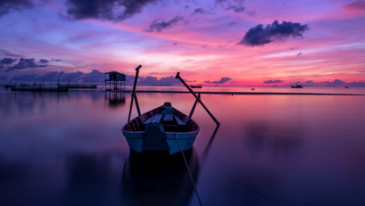 Wooden Boat At Sunset
