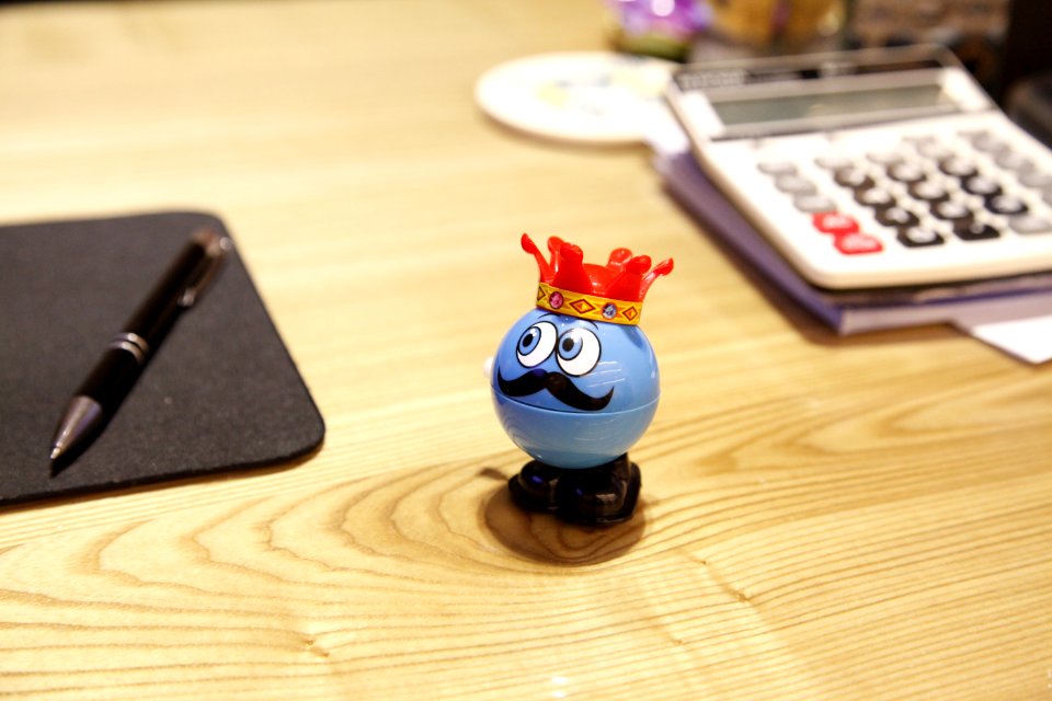 Blue Round Plastic Toy On A Desk