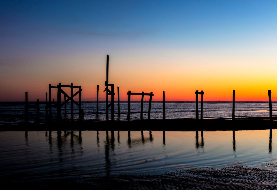 Pier pilings at dusk along the Gulf of Mexico, between Waveland and Bay St. Louis in Hancock County, Mississippi. Original image from Carol M. Highsmith’s America, Library of Congress collection.
