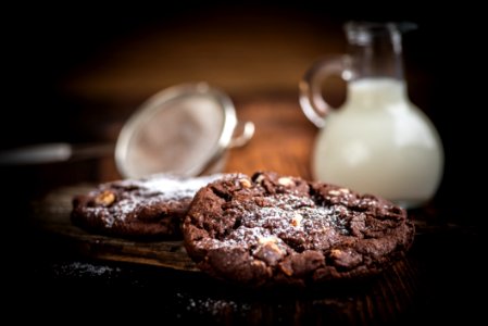 Brown Cookie Chips Near Clear Glass Jar With White Liquid photo