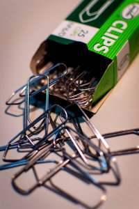 Stainless Steel Clips On White Table photo