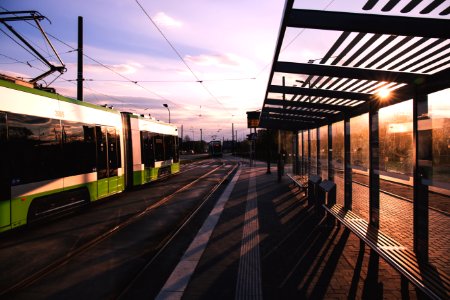 Green And White Train Near Train Terminal During Daytime photo