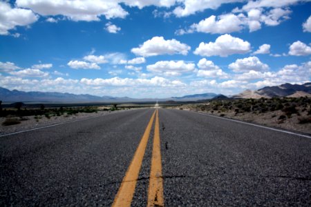 Black Top Road Under Clear Blue Cloudy Sky photo