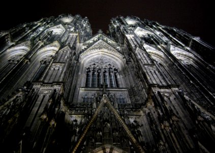 Low Angle Photography Of Gray Concrete Cathedral At Nighttime photo