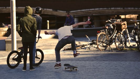 Man In White Shirt Doing Skateboard Trick