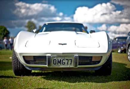 White Corvette C3 With Omg77 License Plate On Display