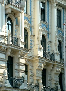 White Wall Statue On High Rise Building photo