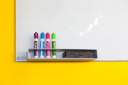 Colorful Markers At Whiteboard