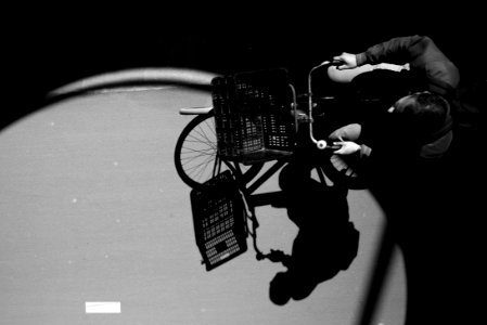 Gray Scale Photo Ofman On City Bike photo