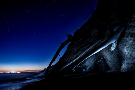 Cliff At Night With Starry Skies