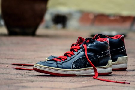 Black And Red Leather Puma Lace Up High Top Shoes photo