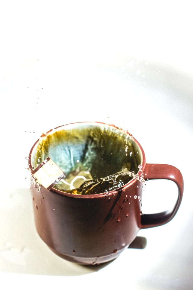 Tea Bag Splashing In Cup