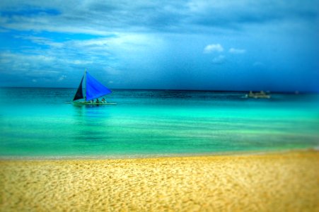 Painting Of Blue Boat On Beach photo