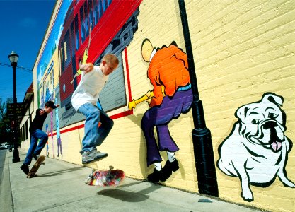 Actual skateboarders mimic those on a street mural, Louisville, Kentucky (1980-2006) by Carol M. Highsmith. Original image from Library of Congress. photo