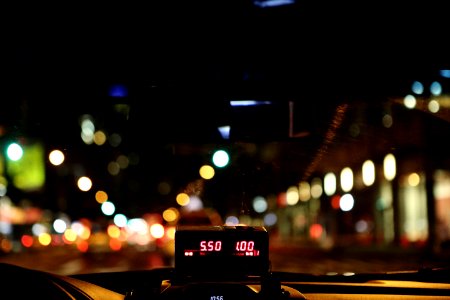 Meter Of Taxi Cab Driving Through City photo