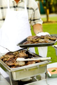 Person Holding Stainless Steel Tray