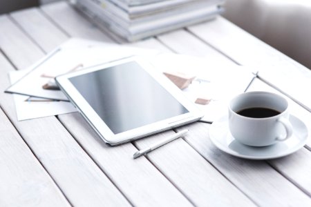 White Tablet And Cup Of Coffee photo