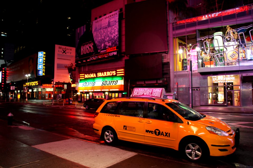 Yellow Hvc Taxi On Road During Night
