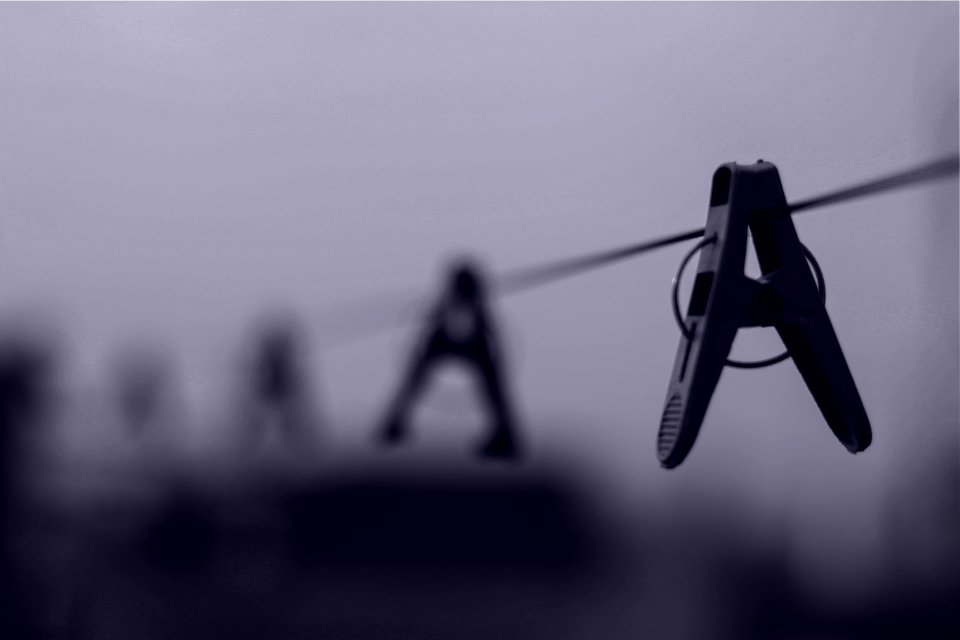 Gray Scale Image Of Clothes Pin On Clothes Line