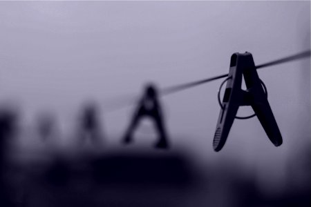 Gray Scale Image Of Clothes Pin On Clothes Line