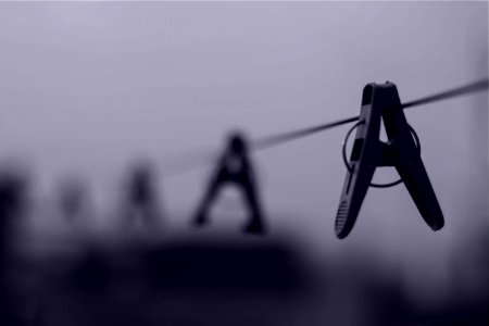 Gray Scale Image Of Clothes Pin On Clothes Line photo