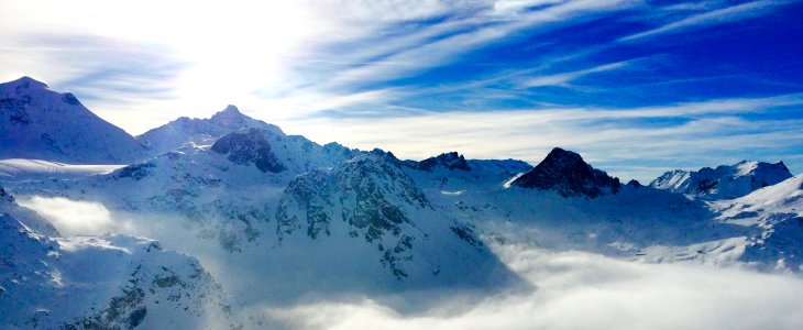 White Snow Covered Mountain Under Blue Sky photo