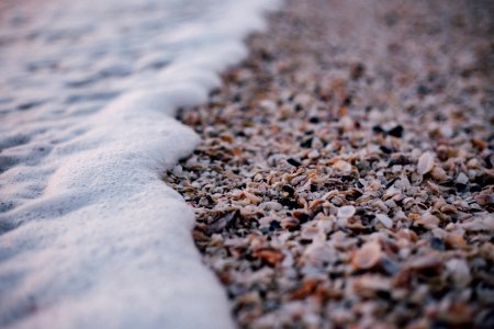 White And Grey Pebbles Near Sea Shore