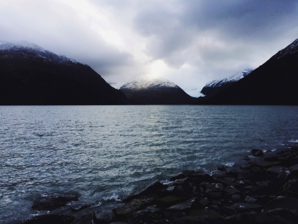 Cloudy Skies Over Alpine Lake
