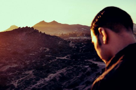 Man Overlooking Mountain Valley