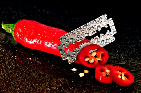 Red Chili Pepper Sliced By A Blade photo