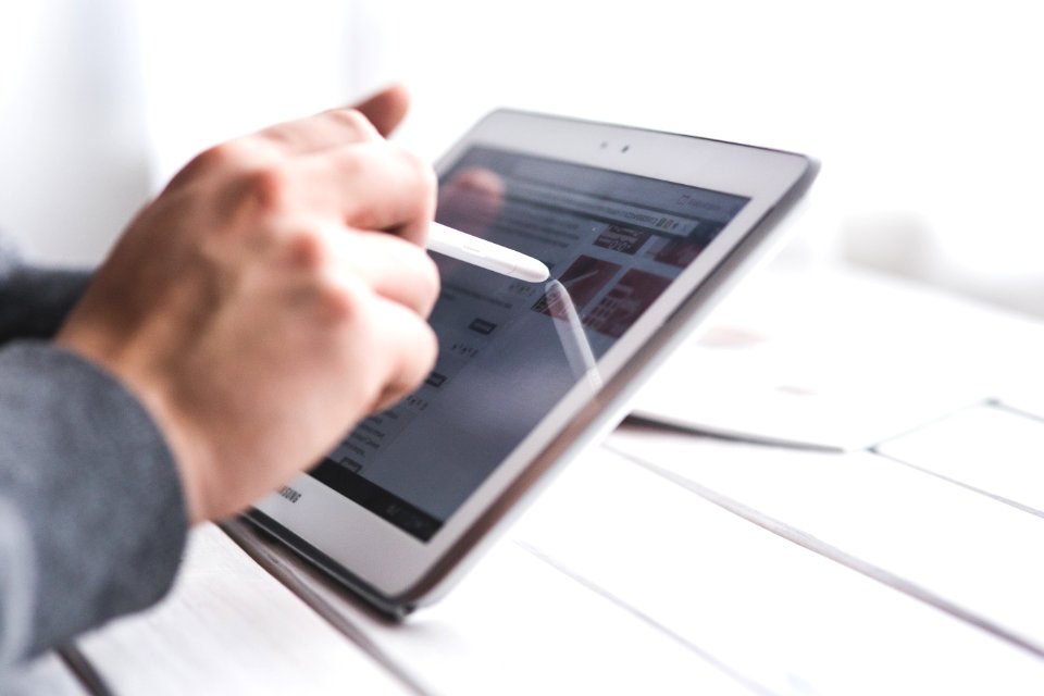 Hand Using Stylus Pen For Touching The Digital Tablet Screen