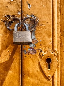 Padlock On Metal Door