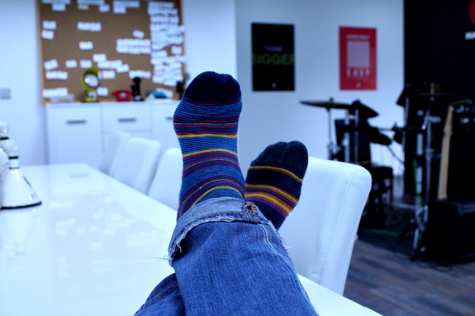 Person Wearing Blue Black Yellow Red Socks