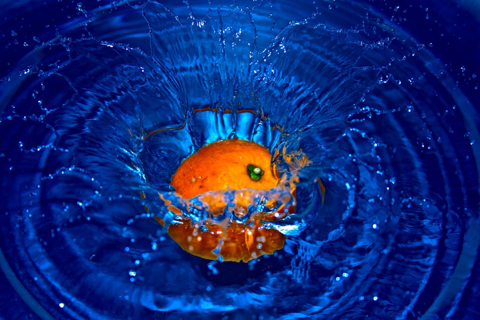 Orange Drop In Water In Time Laps Photography