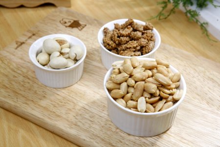 Brown Nuts On White Ceramic Bowl photo