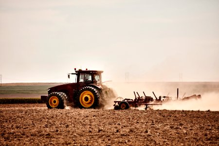 A farmer kicks up dust as he readies the ground for planting near Bristol in Prowers County, Colorado. Original image from Carol M. Highsmith’s America, Library of Congress collection. photo