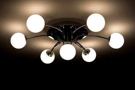 Silver Flush Mount Ceiling Light With Seven White Globe Lights photo