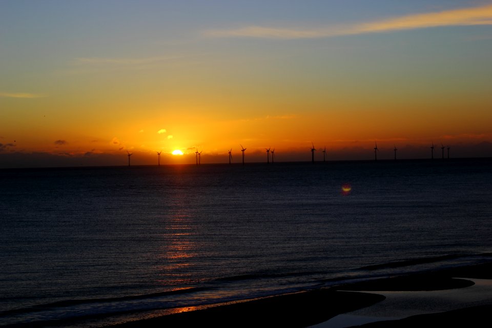 Windfarm Silhouette At Sunset
