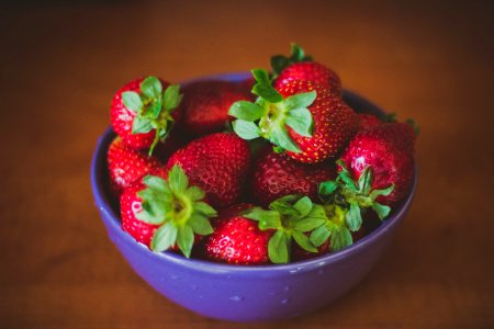 Blue Round Bowl Of Fresh Strawberries photo