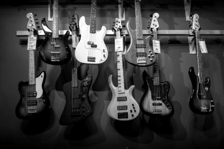 8 Electric Guitars Hanged On Brown Steel Bar