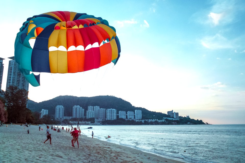 Parachutist Lands On Beach