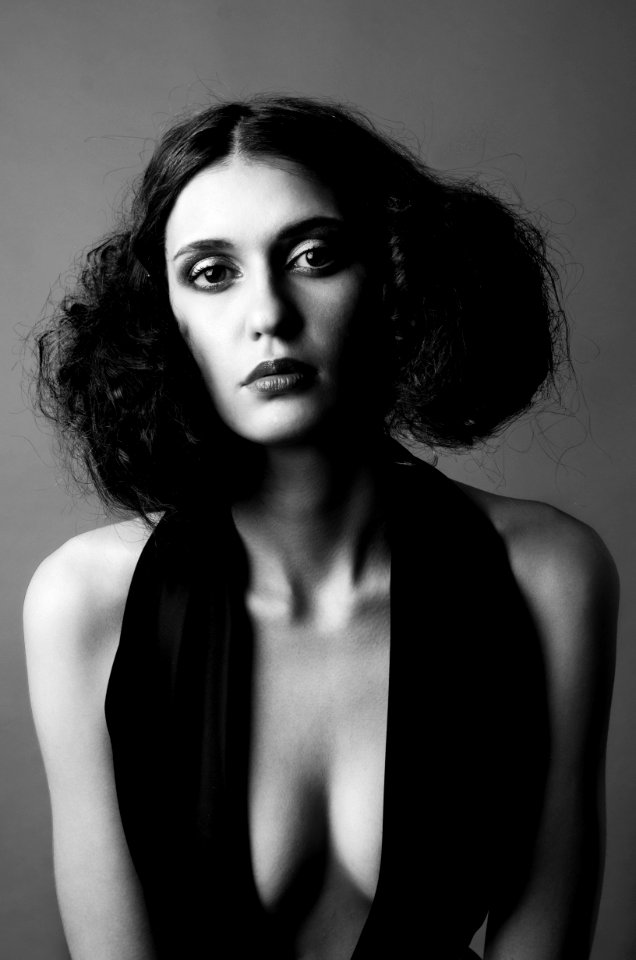 Grayscale Photo Of Woman In Black Scoop Neck Halter Dress