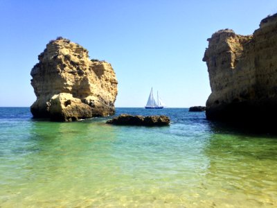 Boat Off Rocky Shores photo