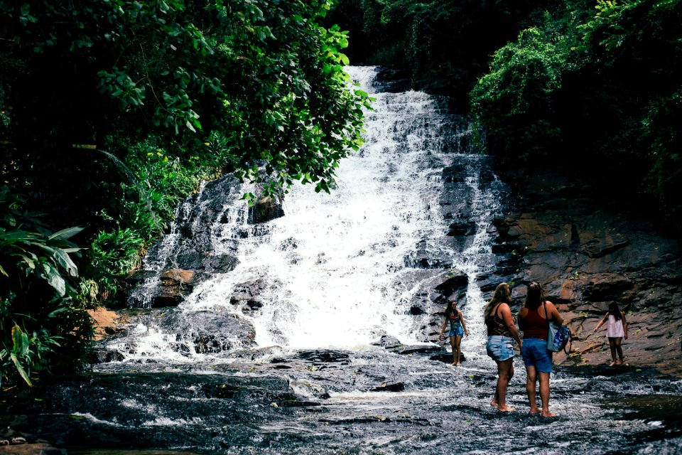 Travelers At Waterfall